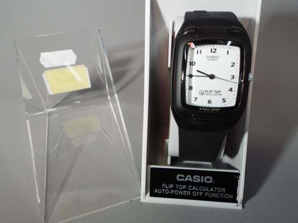 Casio Fliptop - a Casio Fliptop calculator auto power wristwatch in original box with instructions