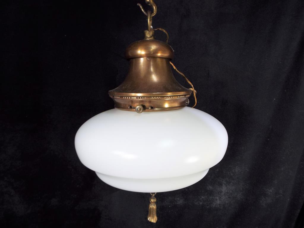 An early 20th century glass ceiling light with original hanger and tassel originally from church,