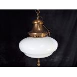 An early 20th century glass ceiling light with original hanger and tassel originally from church,