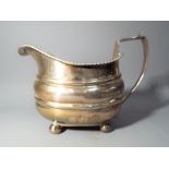 A George III silver hallmarked sauceboat London assay 1812, approximately 143 grams all in.