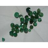A lot comprising of approximately 5 carats of loose rough cut emerald gem stones (client believes