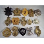 A collection of military cap badges to include 93rd (Sutherland Highlanders) Regiment, Lovat Scouts,