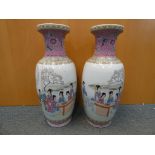 A pair of large Chinese vases, depicting ladies in a garden setting, Ruyi border to the neck,