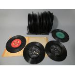 A small quantity of 45 rpm vinyl records to include Buddy Holy, Beatles,