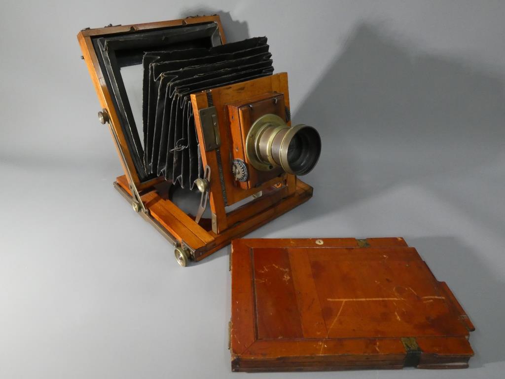 A Thornton Pickard mahogany and brass plate camera.