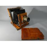 A Thornton Pickard mahogany and brass plate camera.