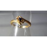 A hallmarked 18 carat gold sapphire and diamond trilogy ring size O1/2, approximate weight 2.