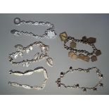 Five ornate silver bracelets