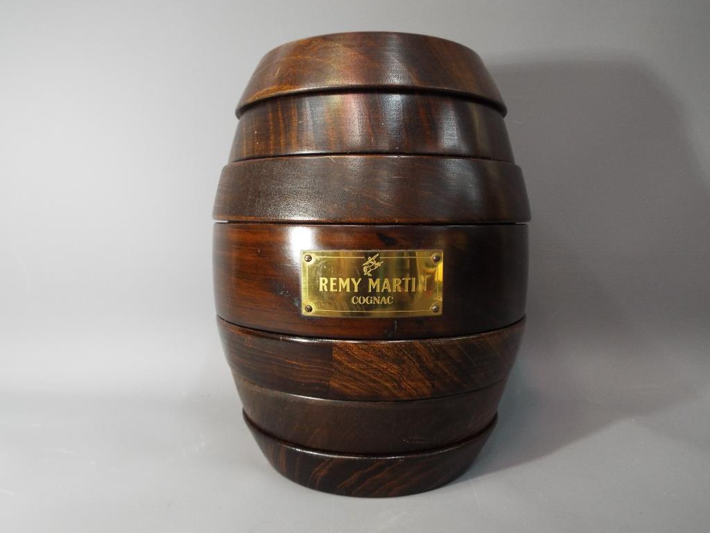 A Remy Martin wooden games compendium in the form of a barrel