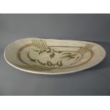 Laurel Keeley - A stoneware dish with incised and painted fish decoration, signed to the base,