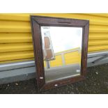 A good quality bevel edged wood framed wall mirror with carved decoration