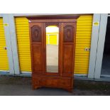 A good quality wardrobe with bevelled mirror front and single lower drawer,
