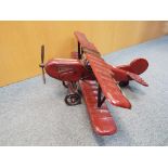A wooden model of biplane approximately 35 cm x 68 cm x 77 cm.