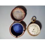 An E B Meyrowitz guild metal pocket barometer contained in fitted leather case approximately 4.