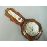 An aneroid barometer and thermometer mou