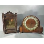 A Smith Sectric mahogany cased mantel clock and an oak cased mantel clock with carved decoration.