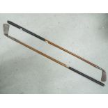 Two vintage wooden shaft gold clubs