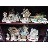A quantity of Pendelfin figurines and display stands,