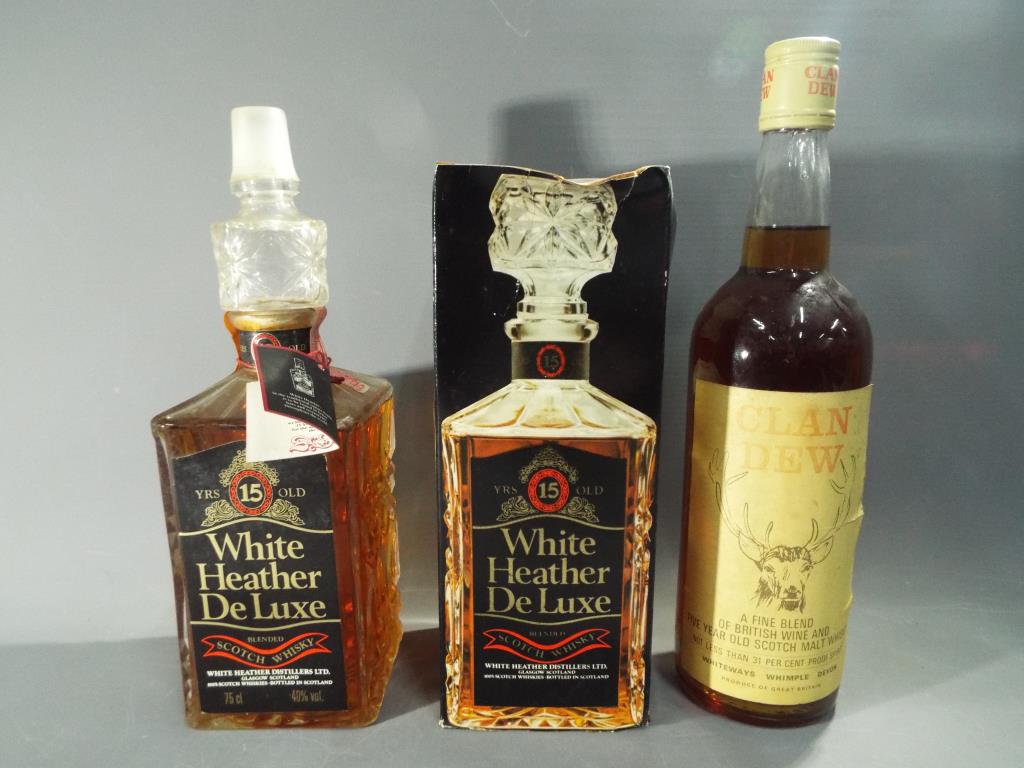 A bottle of White Heather De Luxe 15 year old blended Scotch whisky 75cl 40% ABV in original carton