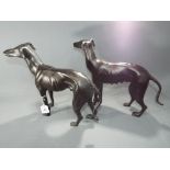 A pair of cast figures depicting greyhounds,