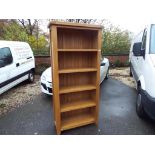 A modern good quality light wood, five shelf bookcase / display unit,