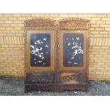 A highly carved Oriental room divider/screen with foliate floral decoration,