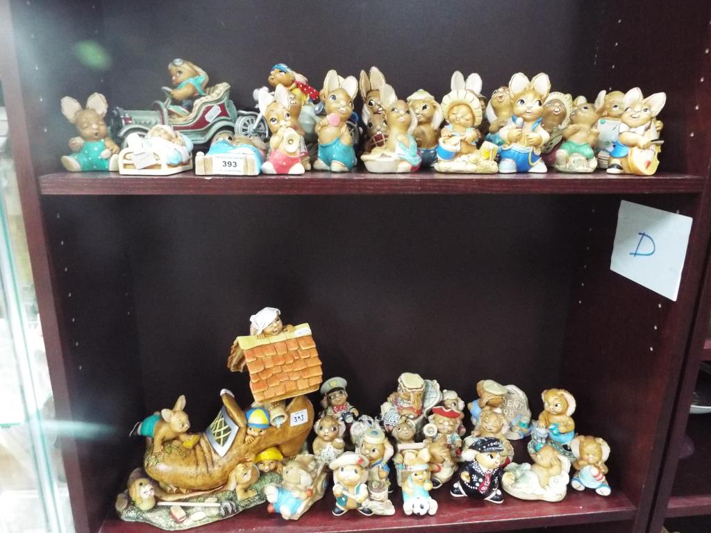 A large quantity of Pendelfin figurines, contained over two shelves,
