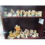 A large quantity of Pendelfin figurines, contained over two shelves,