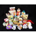 Wombles - a good mixed lot of Wombles collectables to include hard plastic figures, tins,