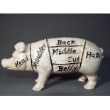 A novelty cast iron Butchers Pig money bank