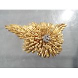 A 14ct gold and diamond cluster brooch, unmarked, approximately 21.7 grams all in.