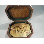 A brass sundial compass marked Cox, London,