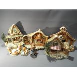 A quantity of Pendelfin, dioramas, figurines, largest approximately 30 cm [H].