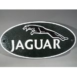 A cast iron Jaguar sign