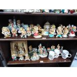 A quantity of Pendelfin figurines and display stand, largest approximately 20 cm [H],