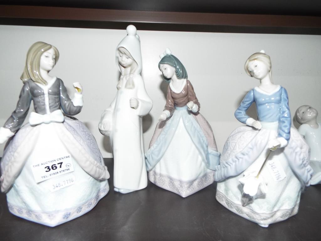 Lladro - four ceramic figurines by Lladro to include #5211 Angela, #5210 Jolie and similar,