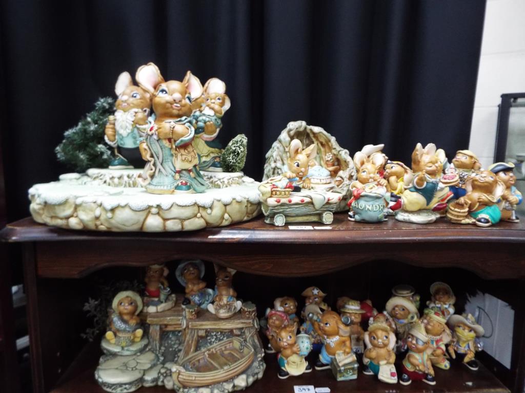 A quantity of Pendelfin figurines and display stands, largest approximately 21 cm [H],