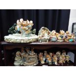 A quantity of Pendelfin figurines and display stands, largest approximately 21 cm [H],