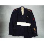 A jacket bearing Red Cross shoulder insignia, cloth Mobile V.A.