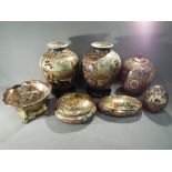 A collection of Oriental ceramics to include vases, ginger jar, lidded dishes and similar,