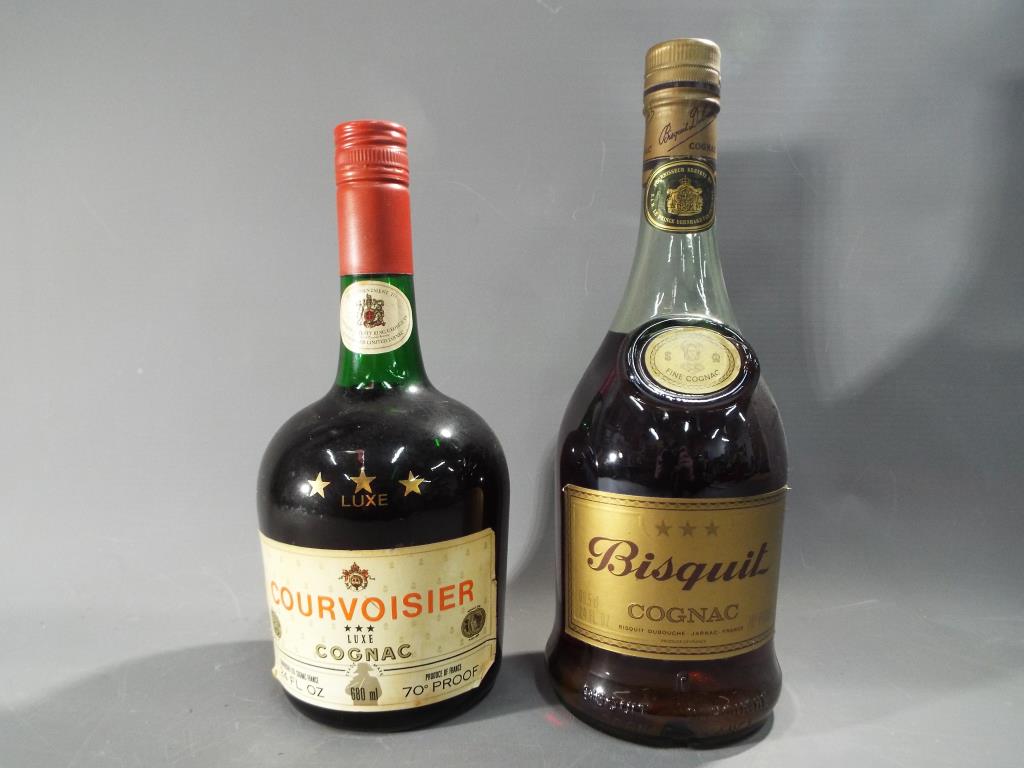 Cognac - A 68cl bottle of Bisquit Dubouche three star Cognac and a 68cl bottle of Courvoisier three