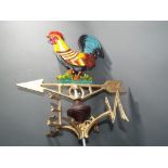 A cast iron weather vane depicting a han