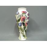 Moorcroft Potteries - a Moorcroft Potteries vase decorated in the Sweet Pea pattern approx 20cm