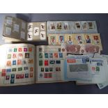 A stamp album containing UK and foreign stamps, loose envelopes,