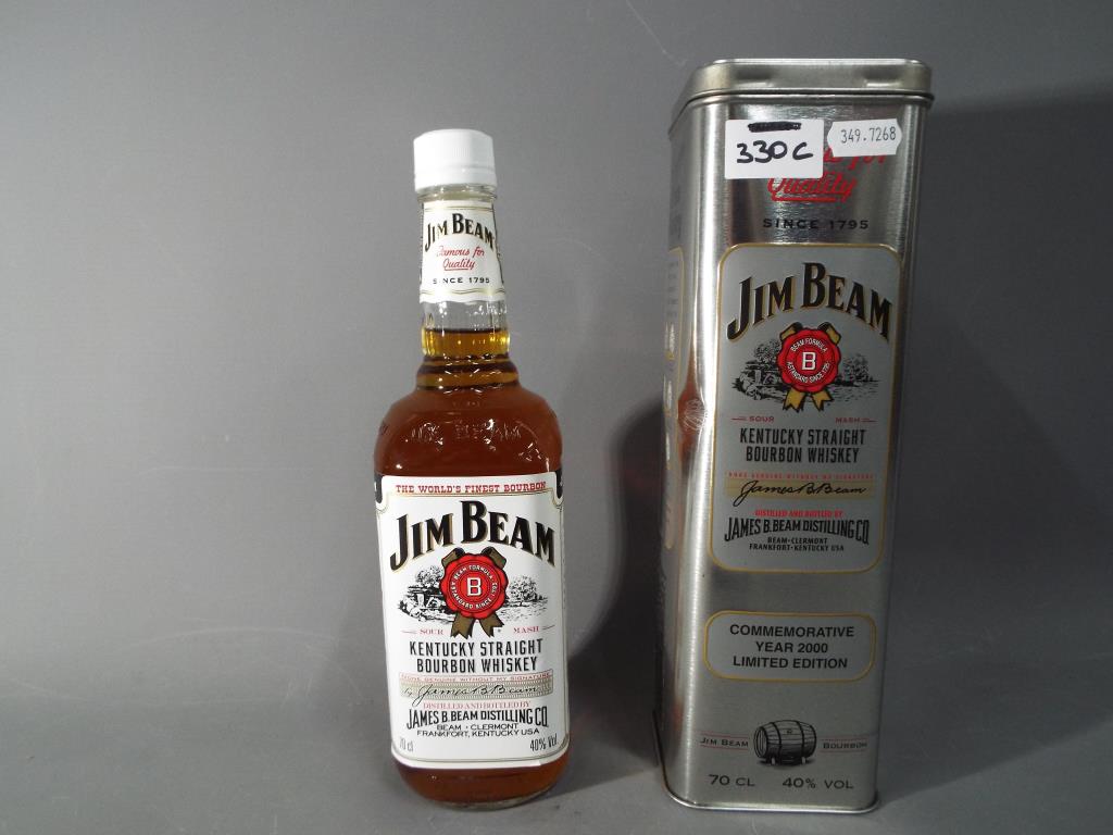 A bottle of Jim Beam contained in a tin commemorating Year 2000 Limited Edition,