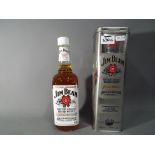 A bottle of Jim Beam contained in a tin commemorating Year 2000 Limited Edition,