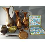 Metalware - a quantity of copper jugs of varying sizes, a bedpan, an Oriental bell and dish,
