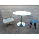 A modern circular table and a small occasional table and upholstered swivel chair [3] This lot must