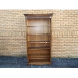 An Old Charm freestanding bookcase measuring approximately 188 cm x 99 cm x 35 cm.