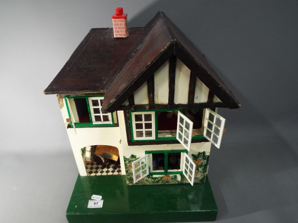 Dolls House - a dolls house by L Bros Tri-ang, two storey high, approx 42cm,